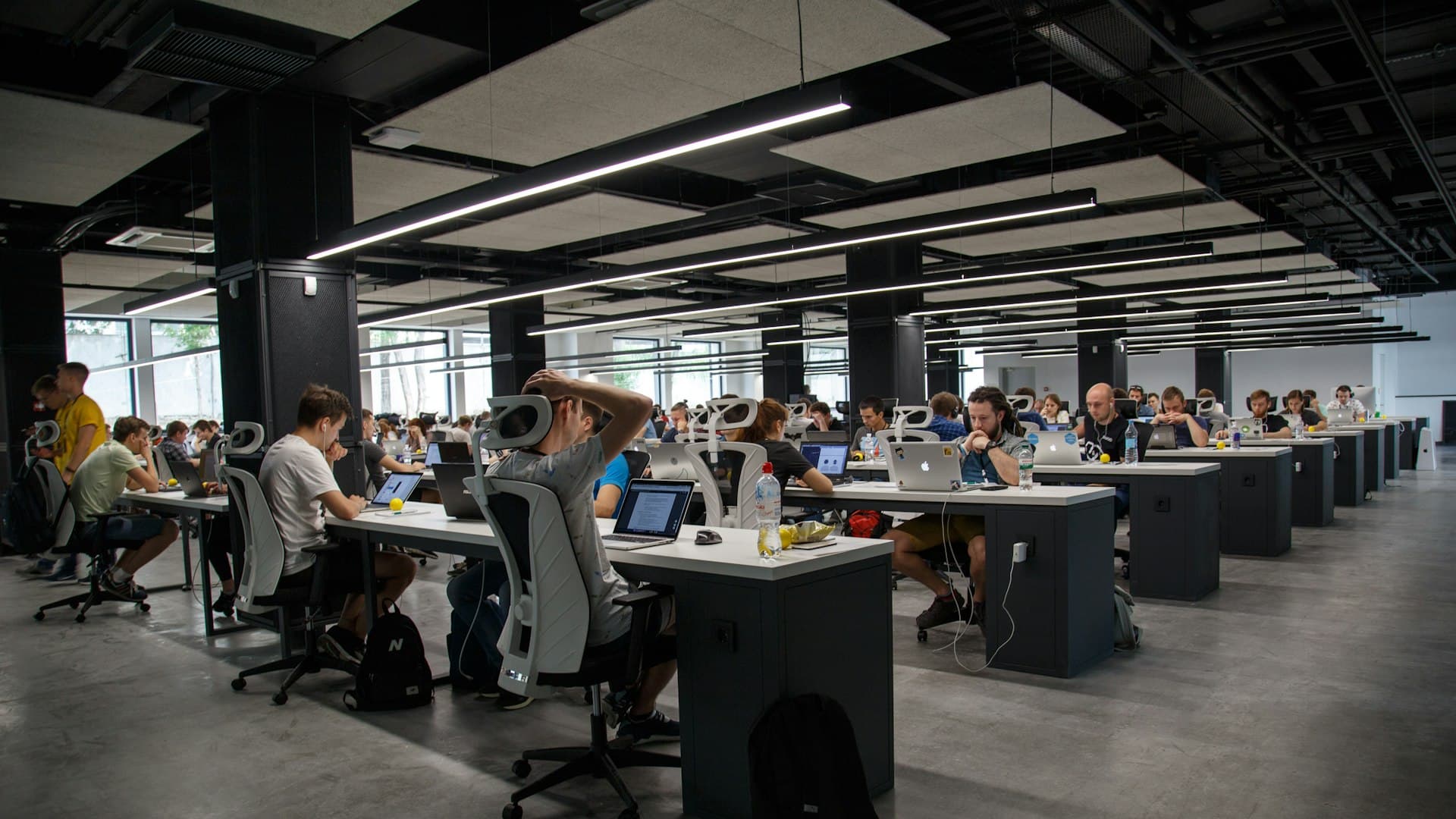 Hackathon teams working on laptops through the night